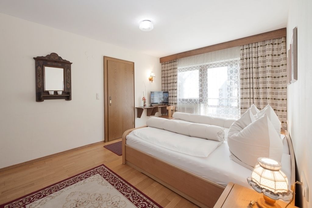 family room, 2 bedrooms, garden view, garden area | in-room safe, bed sheets