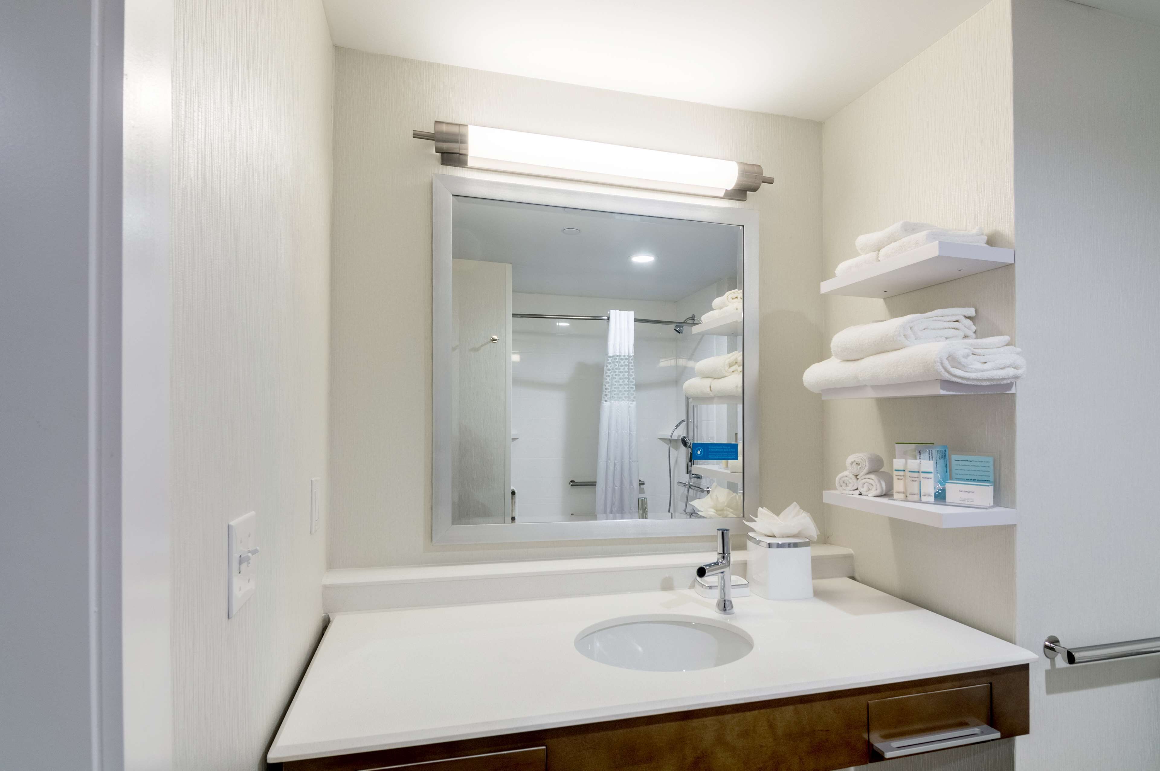 hydromassage showerhead, hair dryer, bathrobes, towels