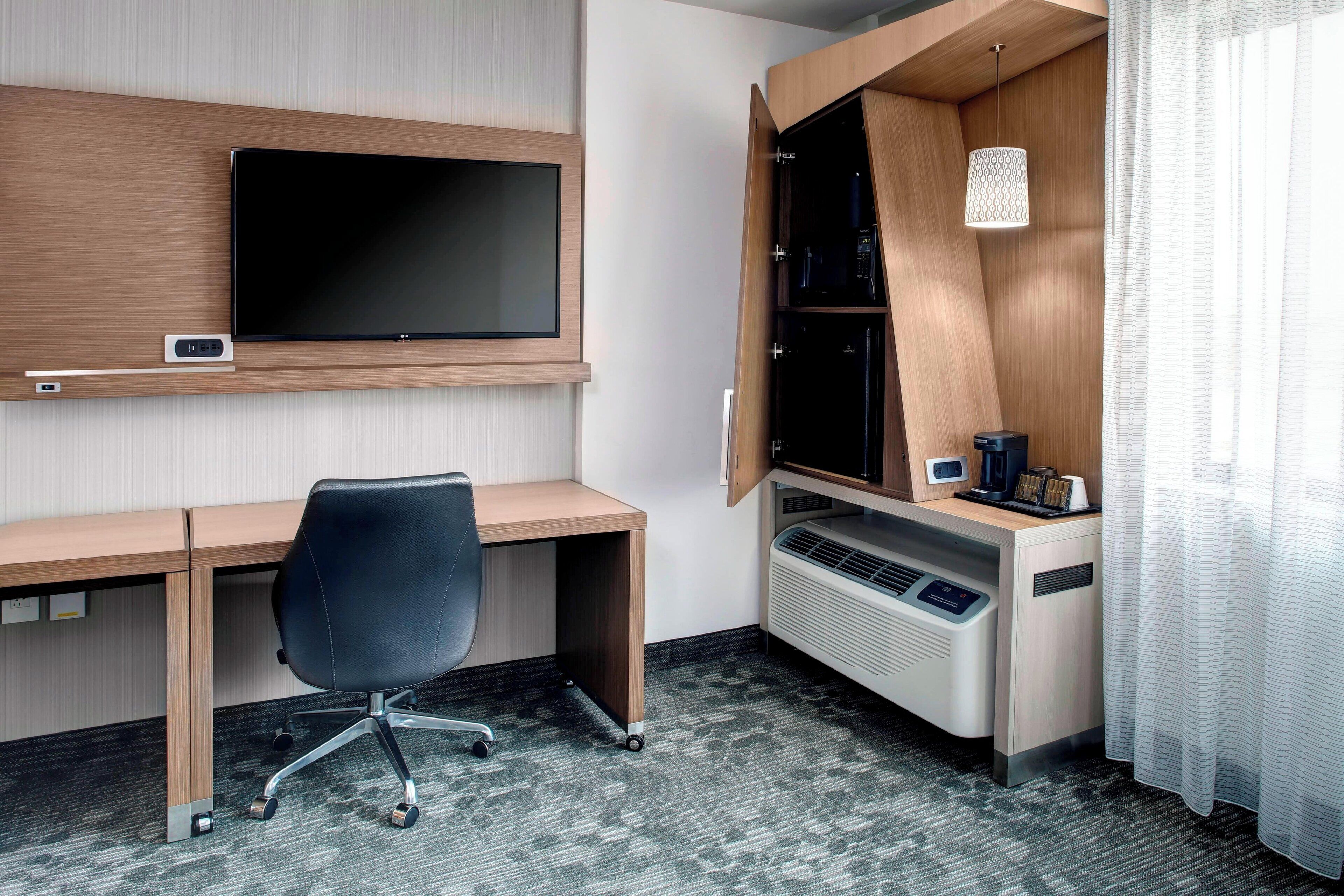 desk, laptop workspace, blackout curtains, iron/ironing board