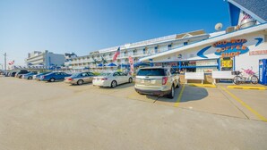 A hotel with a parking lot, a coffee shop, and a sign for 'Doo-Wop Coffee Shop'. - Tangiers Motel (Wildwood Crest)