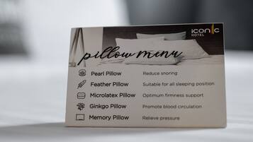 A pillow menu from Icon Hotel detailing different pillow types: Pearl Pillow (reduce snoring), Feather Pillow (suitable for all sleeping positions), Microlatex Pillow (optimum firmness support), Ginkgo Pillow (promote blood circulation), and Memory Pillow (relieve pressure).