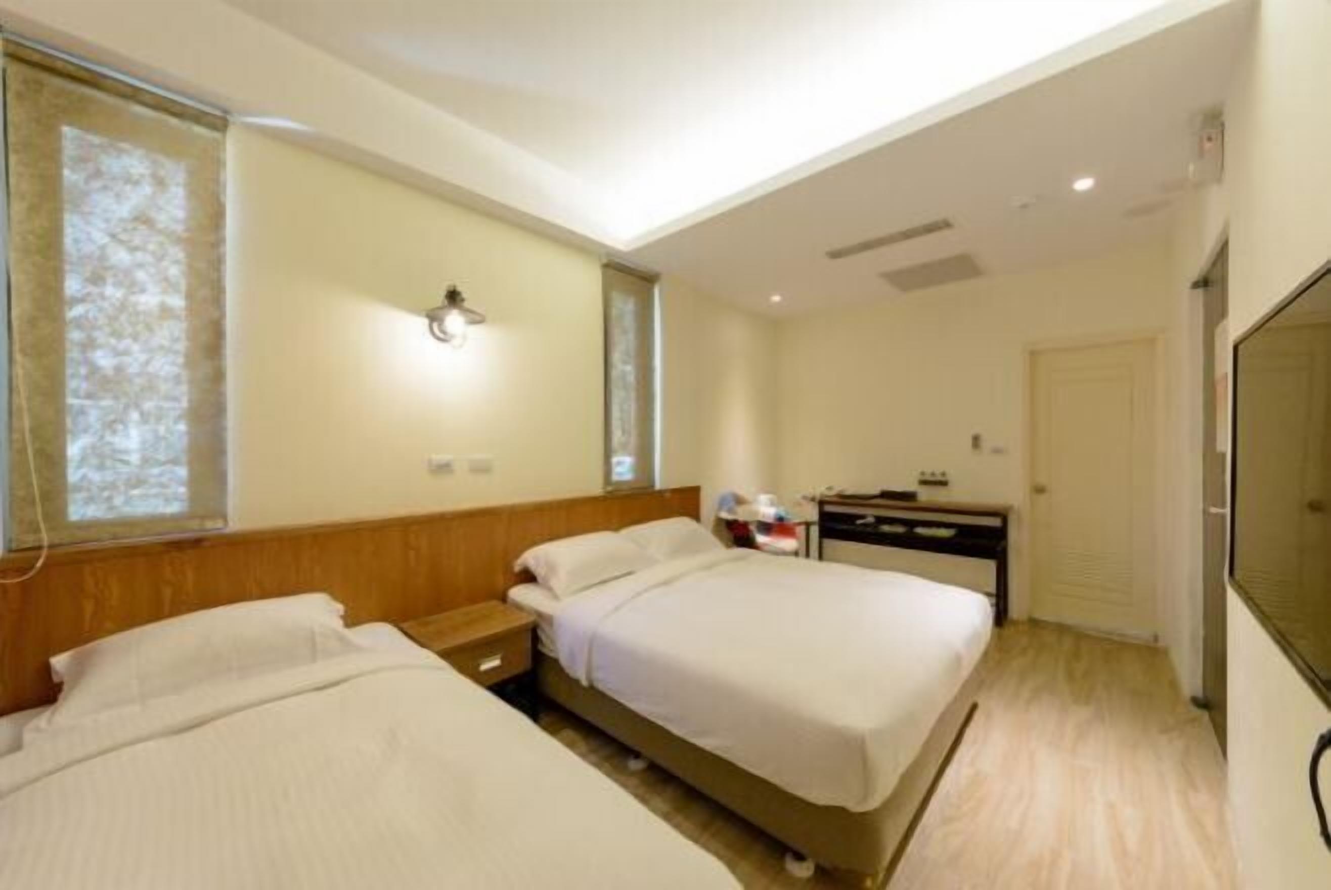 Premium bedding, desk, laptop workspace, blackout drapes