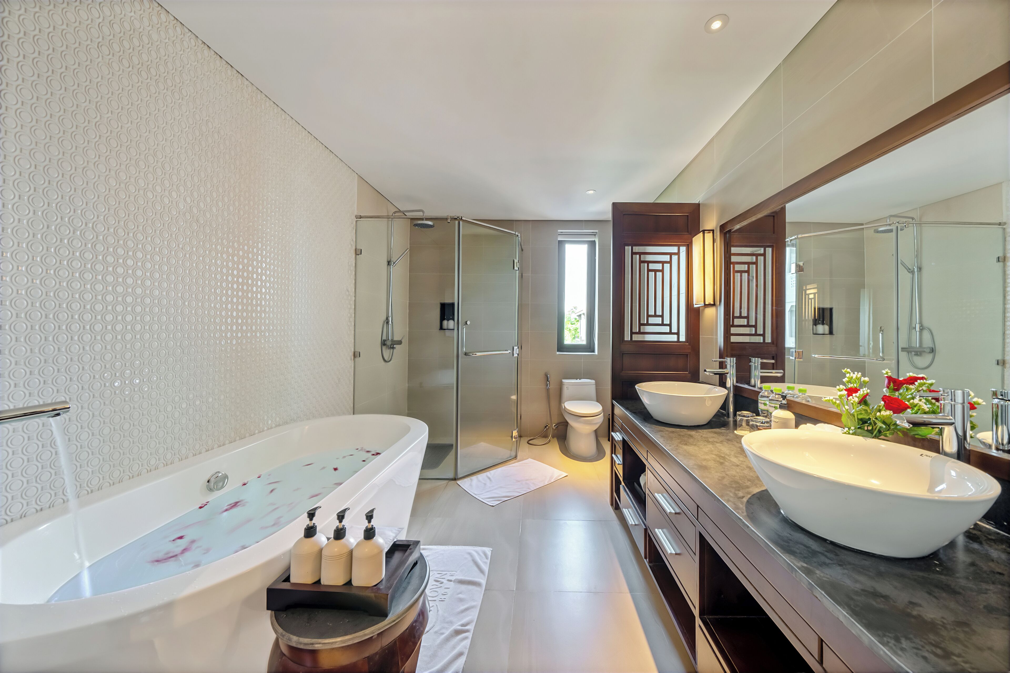 combined shower/bathtub, rainfall showerhead, designer toiletries