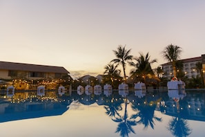 2 outdoor pools, open 5 AM to 8 PM, pool umbrellas, pool loungers