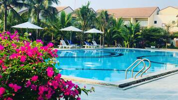 2 outdoor pools, open 5 AM to 8 PM, pool umbrellas, pool loungers