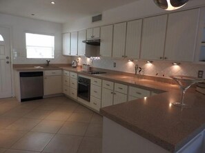 Deluxe Villa, 2 Bedrooms, Kitchen, Harbour View | Private kitchen | Fridge, microwave, oven, stovetop - Villa 244D at Jolly Harbour (Jolly Harbour)