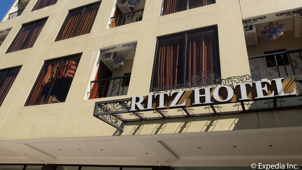 A multi-story building with a sign reading "Ritz Hotel". - Ritz Hotel (Angeles City)