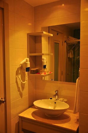 Shower, free toiletries, hair dryer, slippers