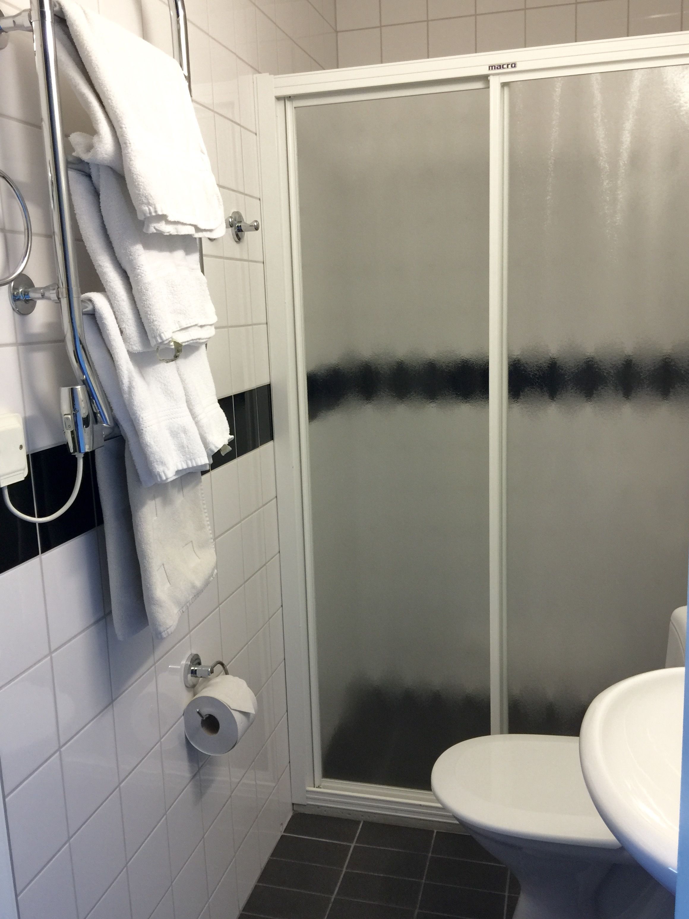 small twin room | bathroom | hair dryer, towels, soap, shampoo