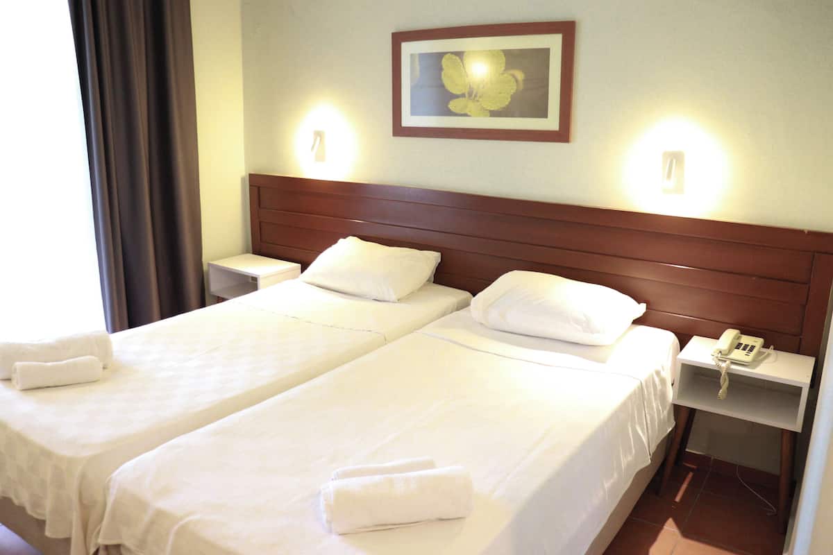 Standard Twin Room, Pool View | Desk, laptop workspace, soundproofing, bed sheets