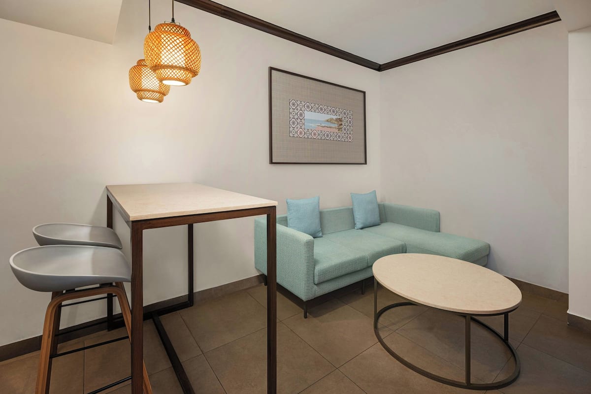 studio suite, 1 queen bed, non smoking, pool view | living room | 43-inch led tv with satellite channels, tv