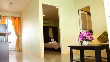 Suite City View | Living area | 26-inch LCD TV with cable channels, TV