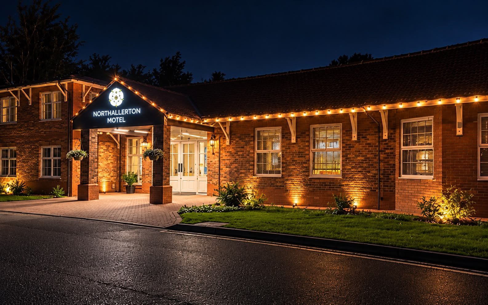A brick building with a sign reading 'Northallerton Motel.'
