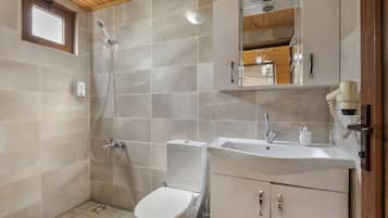 Shower, hair dryer, slippers, towels