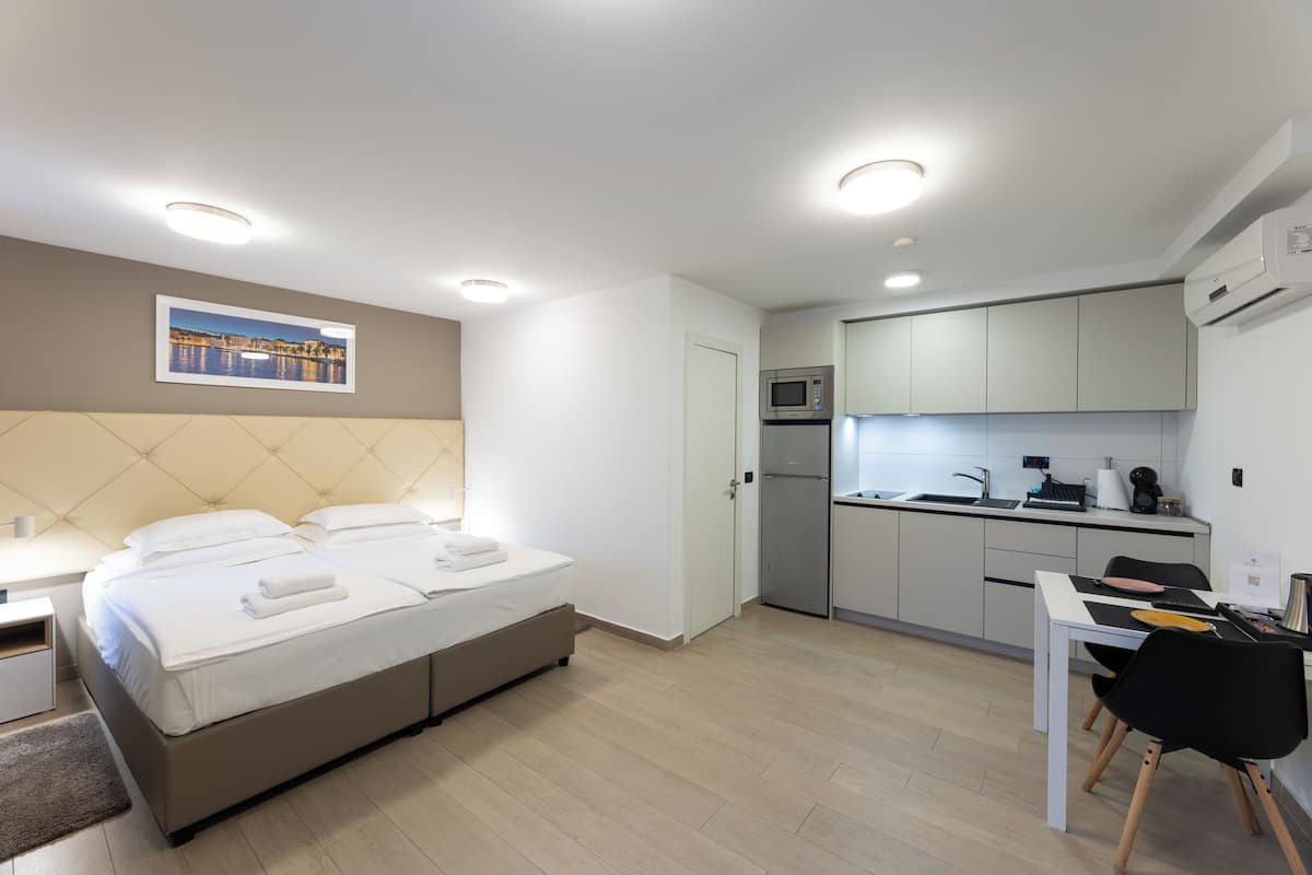 Premium bedding, down duvets, pillow-top beds, in-room safe