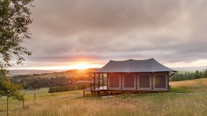 A single-story, open-air structure with a flat roof and a covered porch area. - ArendsRus Country Lodge (George)