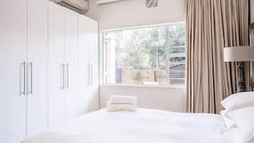 Family Apartment, Multiple Beds | 2 bedrooms, premium bedding, down comforters, pillowtop beds