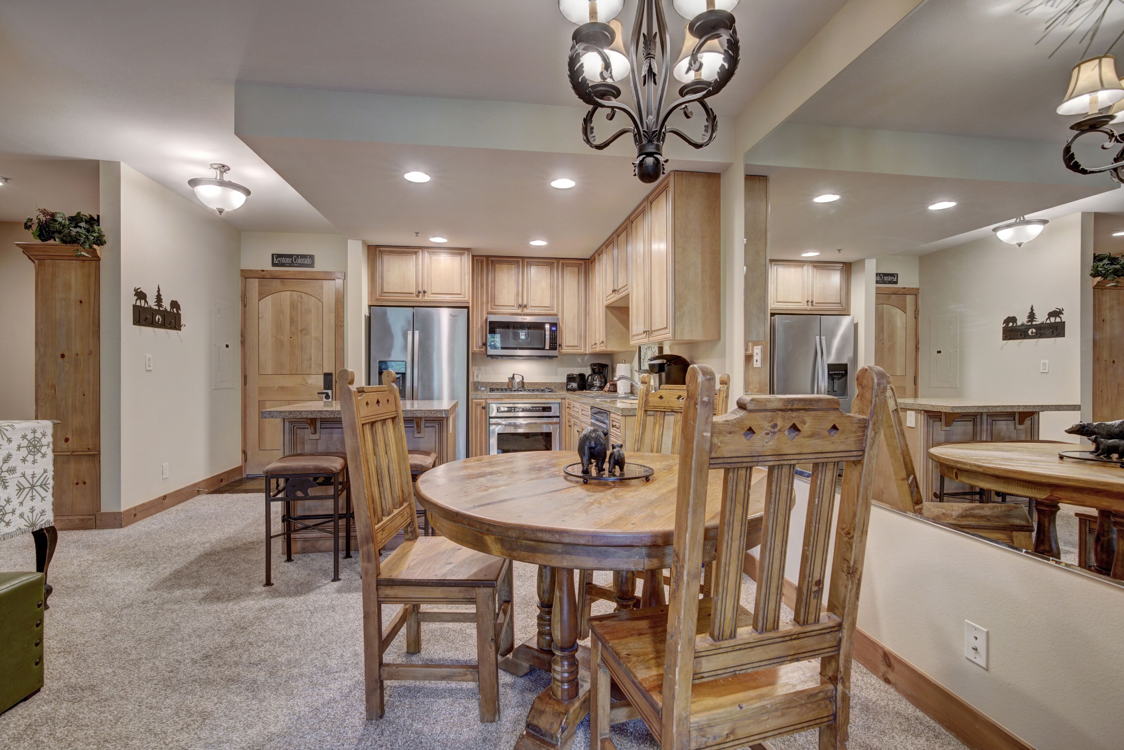 A spacious kitchen with wooden cabinets, a central island, and modern appliances.