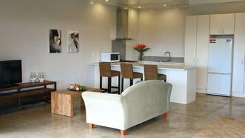 Deluxe Studio | Living room | Flat-screen TV