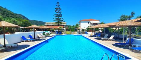 Outdoor pool, pool umbrellas, pool loungers