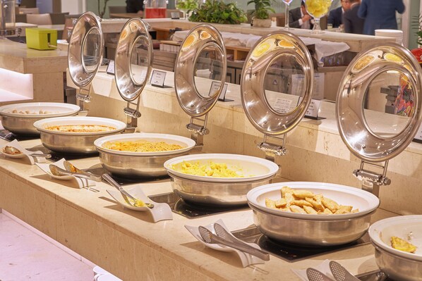 A buffet setup with multiple bowls of food and serving utensils. - Sotetsu Hotels The Splaisir Seoul Myeongdong (Seoul)