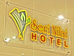 A sign for 'Seri Nila Hotel' with a stylized logo and the name in bold letters. - Hotel Seri Nilai (Nilai)