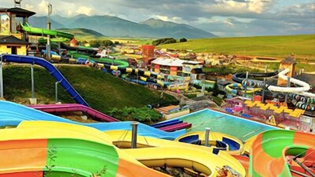 A water park with multiple slides and pools. - Apartmány STAR (Bobrovec)