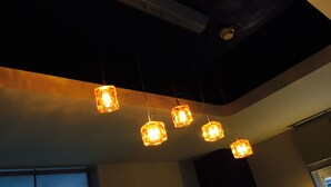 A ceiling with hanging square-shaped lights. - The Evergreen Hostel (Hiroshima)