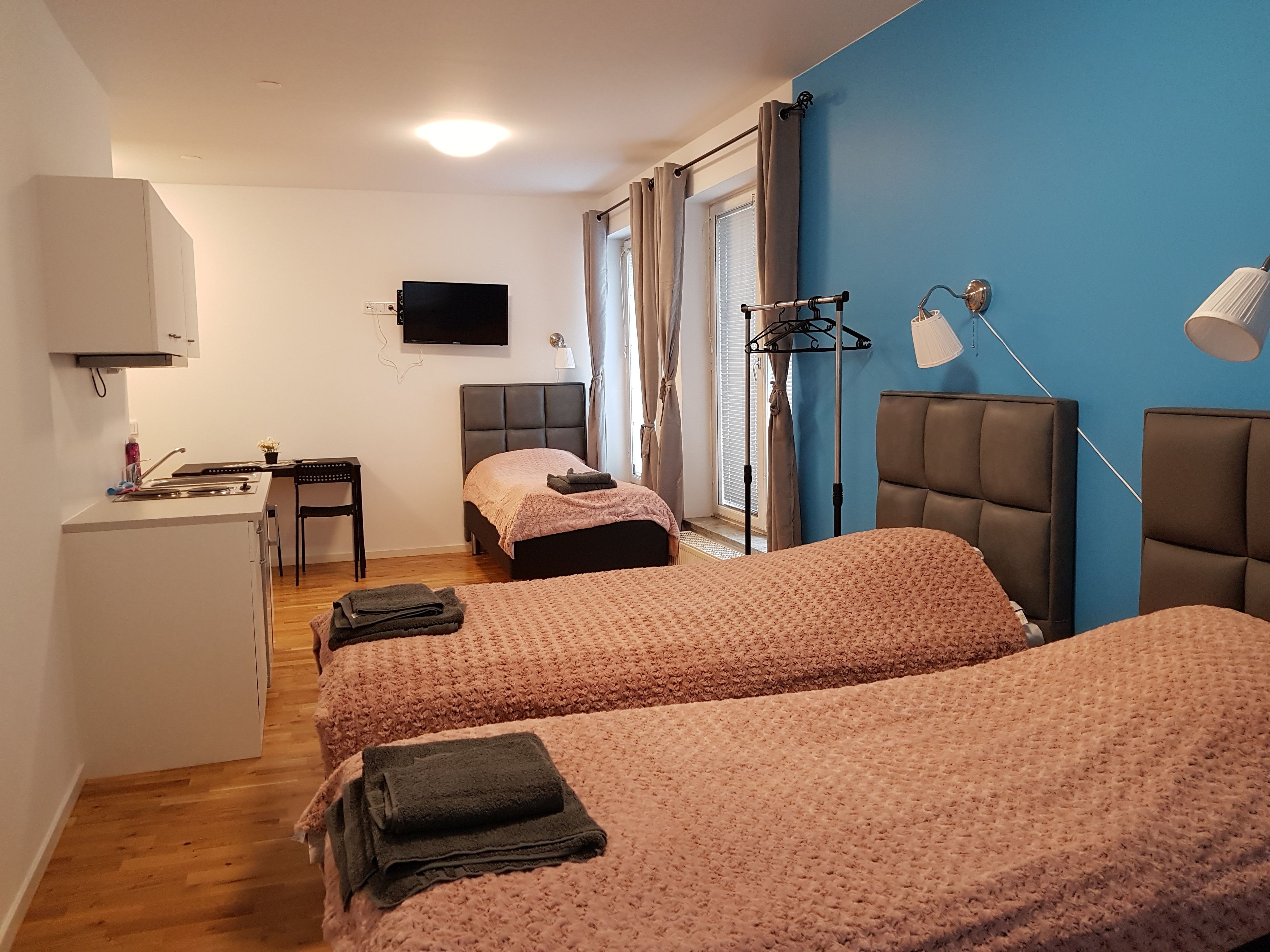 Family Room, Multiple Beds | Living room | 26-inch flat-screen TV with cable channels, TV