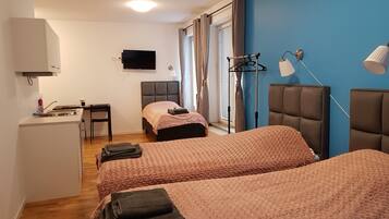 Family Room, Multiple Beds | Living room | 26-inch flat-screen TV with cable channels, TV