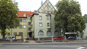 A building with a green facade, multiple windows, and a prominent sign reading "Casino". - Hotel zur Tanne (Zwickau)