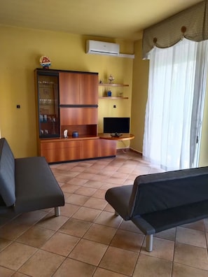 Apartamento | Área de estar | TV de tela plana