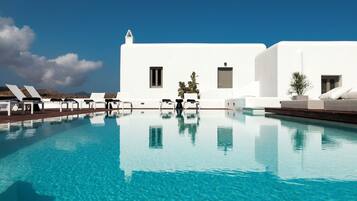 Seasonal outdoor pool, open 8:30 AM to 8:00 PM, pool umbrellas