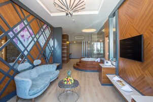 Suite, Jetted Tub, Mountain View | Living room | LCD TV