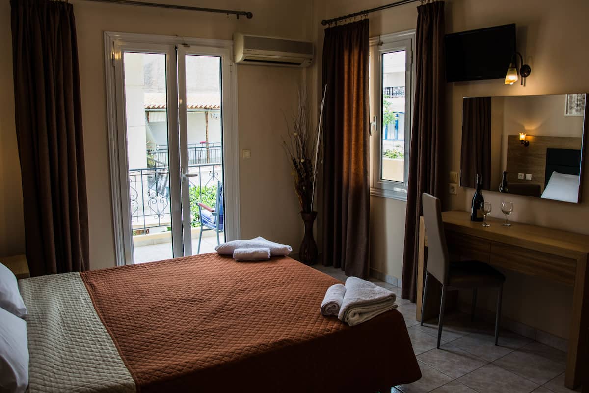 deluxe quadruple room | 1 bedroom, premium bedding, in-room safe, iron/ironing board