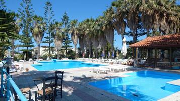 Outdoor pool, pool umbrellas, sun loungers