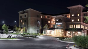 A multi-story hotel with a modern design, featuring a prominent sign for 'Residence Inn Marriott'. - Residence Inn by Marriott Austin Airport (Austin)