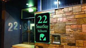 A building entrance with a sign indicating room number 22 and the name 'SmartStay Melbourne'. - SmartStay Melbourne (Windsor)