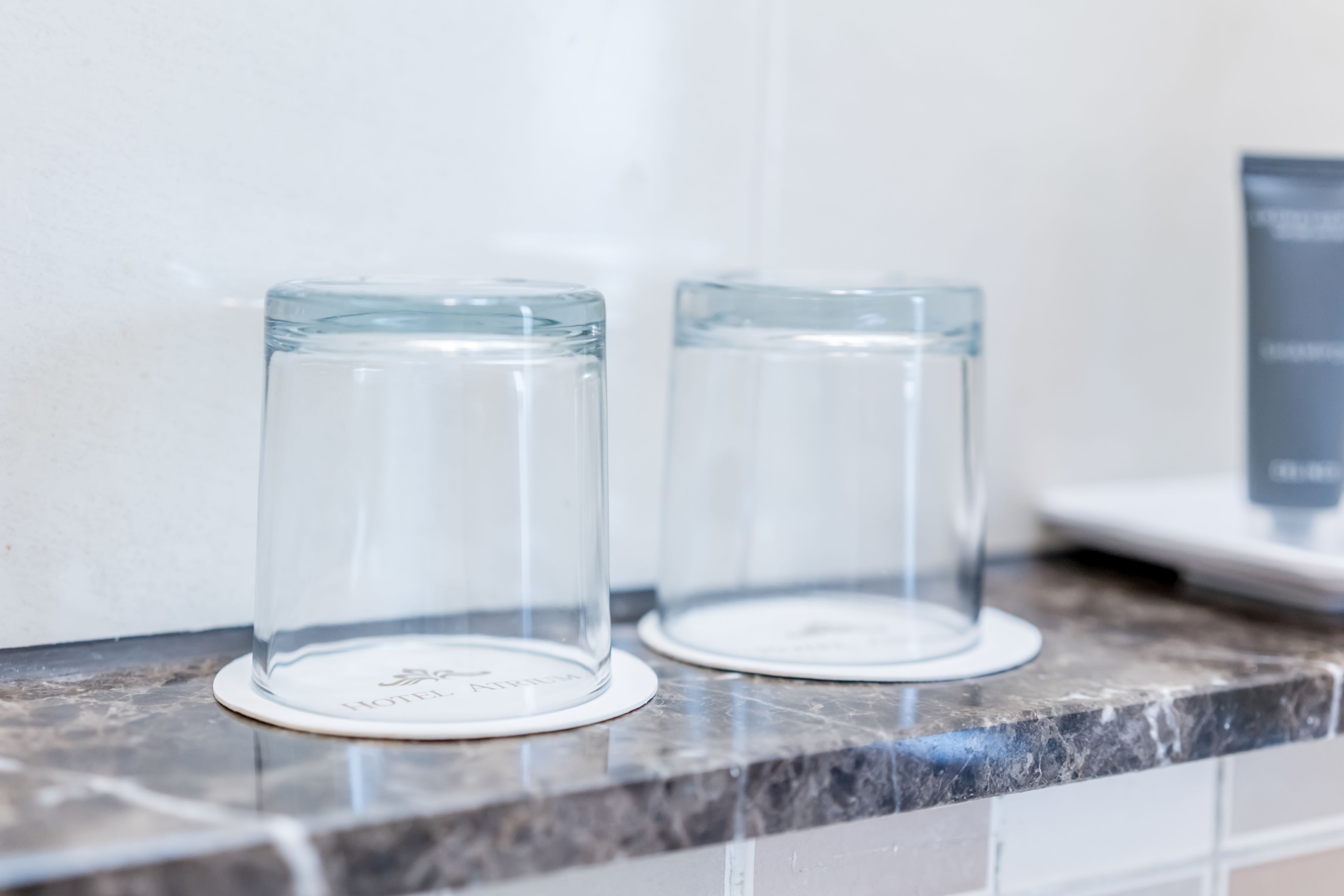 shower, hair dryer, slippers, towels