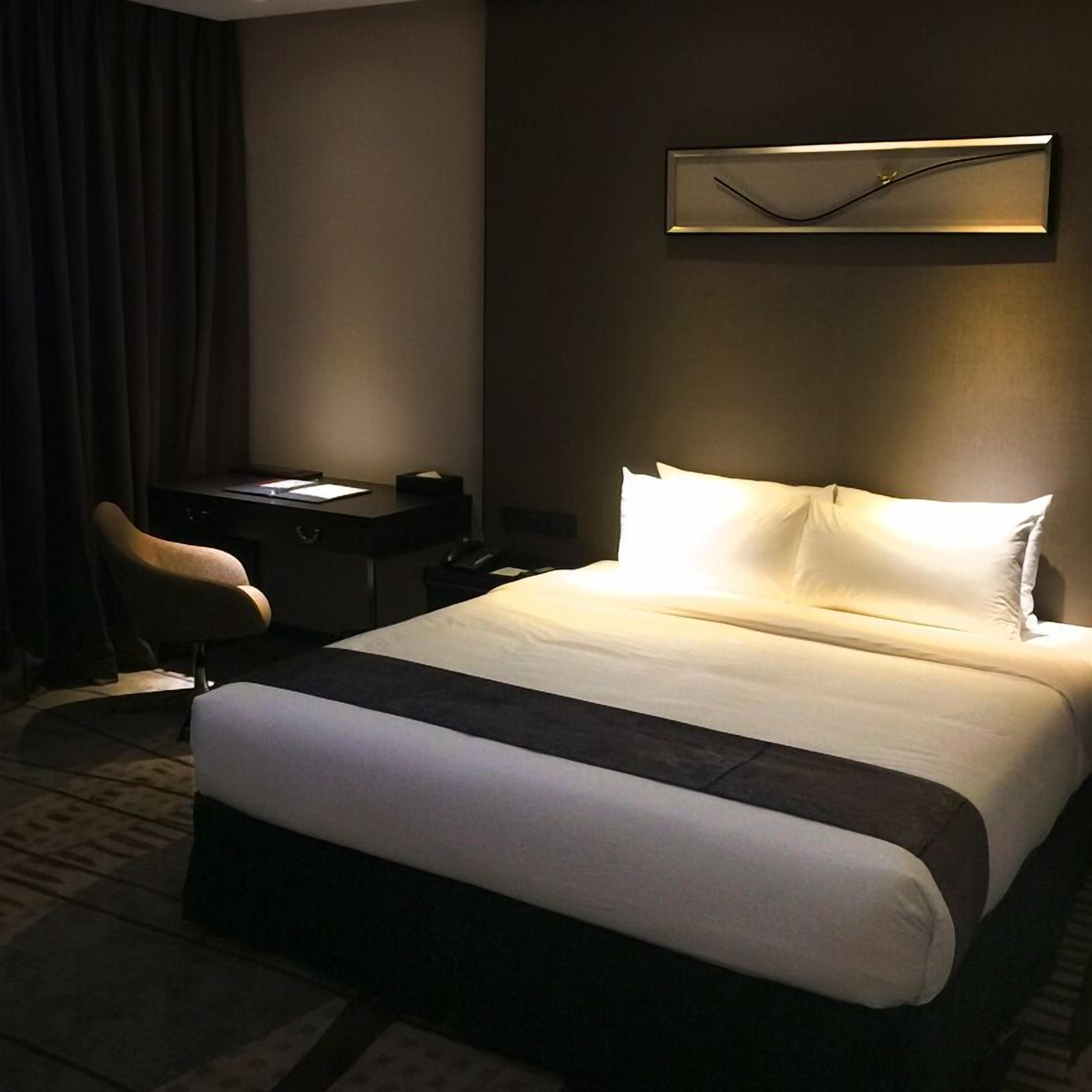 junior suite | in-room safe, desk, blackout curtains, iron/ironing board