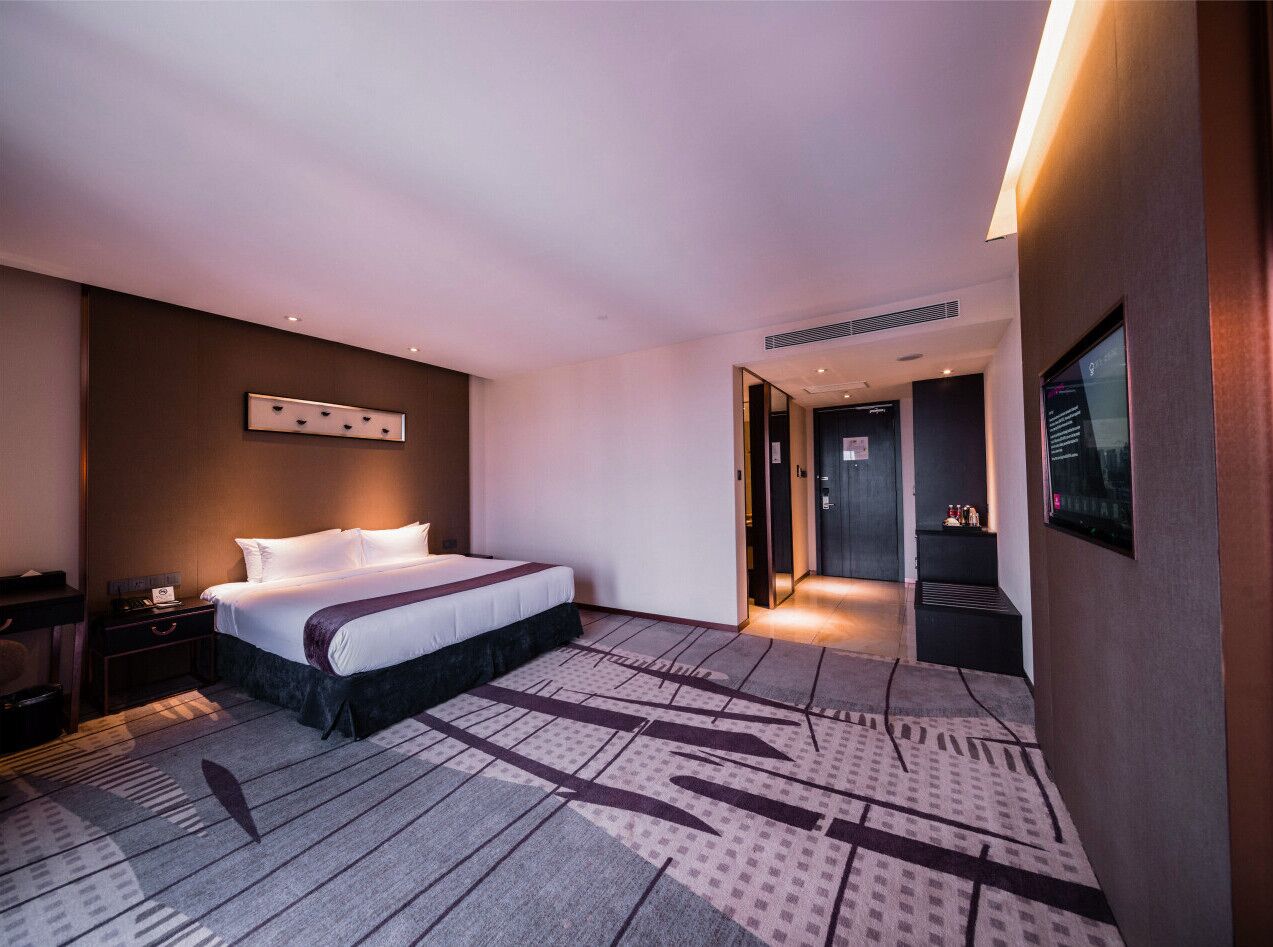 junior suite | in-room safe, desk, blackout curtains, iron/ironing board