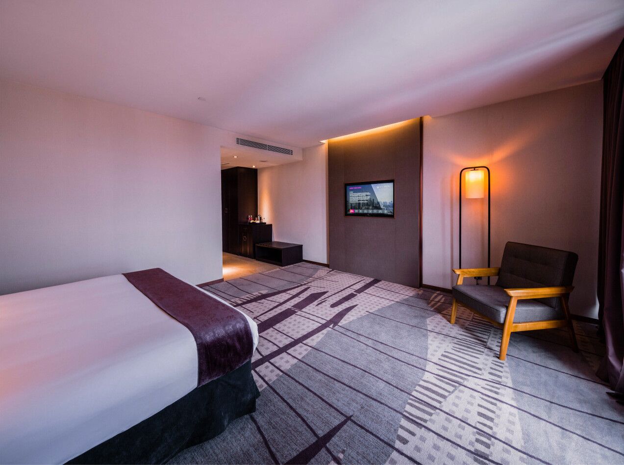 junior suite | in-room safe, desk, blackout curtains, iron/ironing board