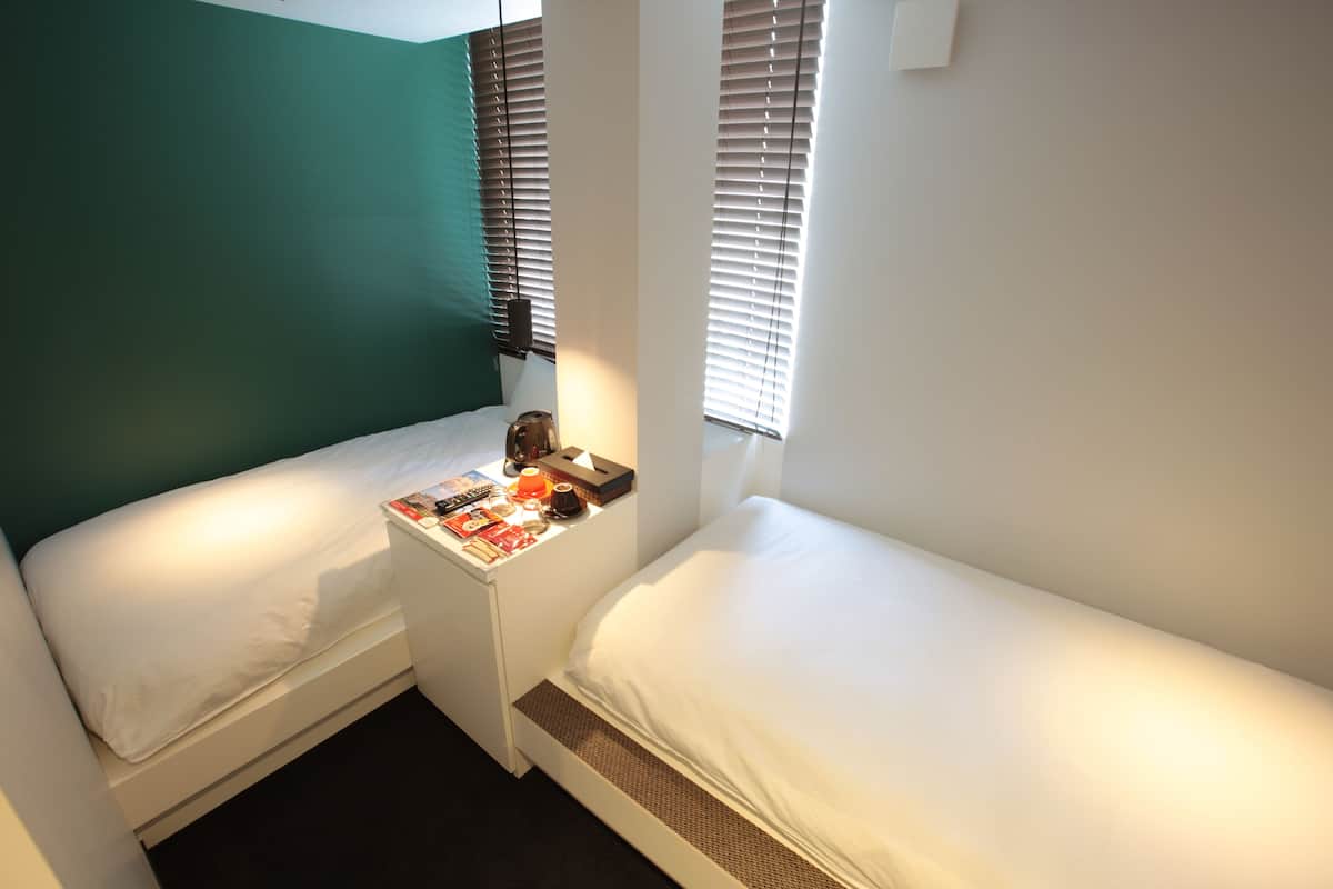 Twin Room, Non Smoking | In-room safe, desk, laptop workspace, iron/ironing board (on request)