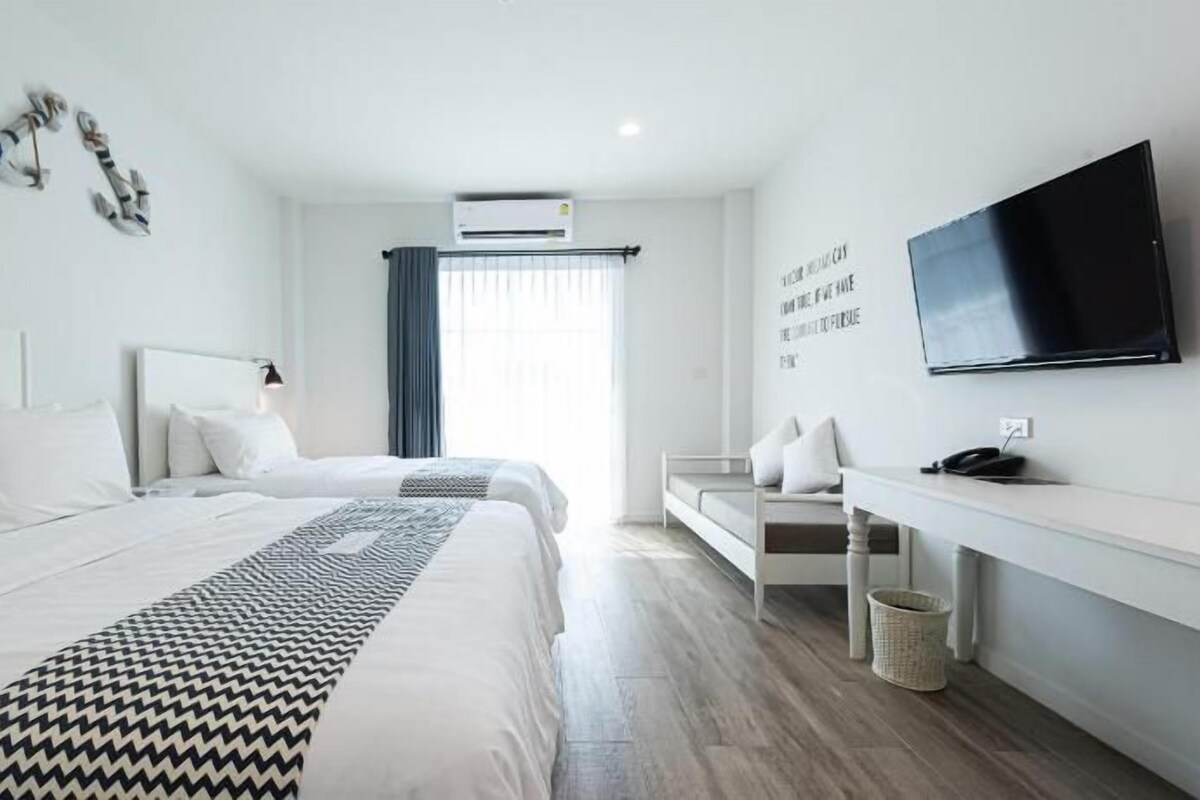 Luxe beddengoed, een kluis op de kamer, een bureau, gratis wifi