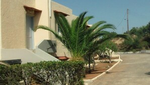 A modern building with a flat roof and a small porch area. - Bellair Village (Malevizi)