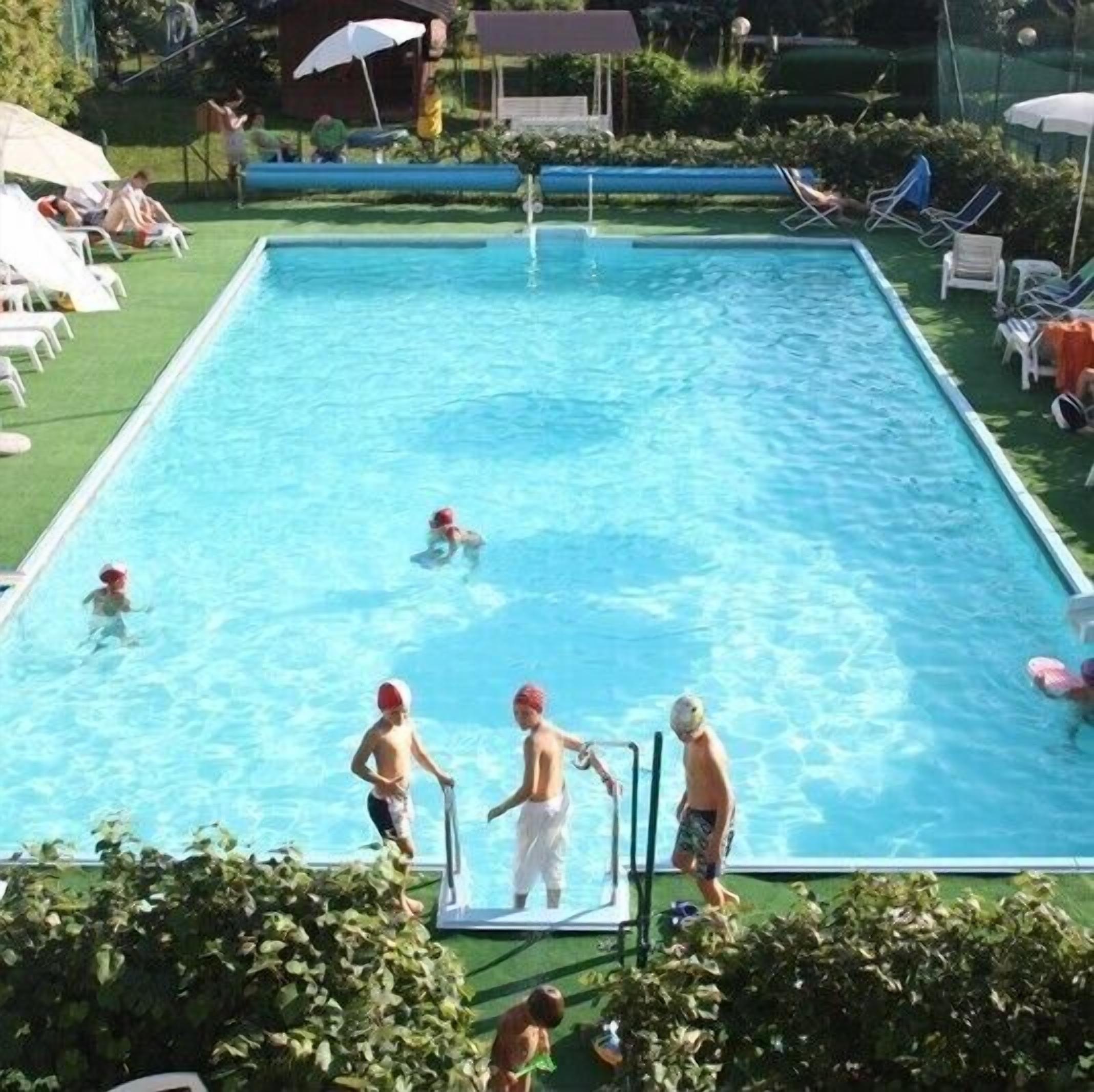 seasonal outdoor pool, pool umbrellas, pool loungers