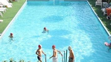 Seasonal outdoor pool, pool umbrellas, pool loungers