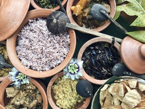 Various food items in clay pots, including rice, vegetables, and other dishes. - Hanthana House (Kandy)