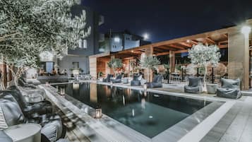 Seasonal outdoor pool, pool umbrellas, pool loungers