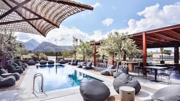 Seasonal outdoor pool, pool umbrellas, pool loungers